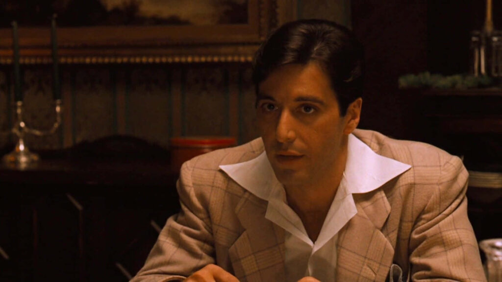 Classic Michael Corleone Wallpaper: Timeless White Suit Background