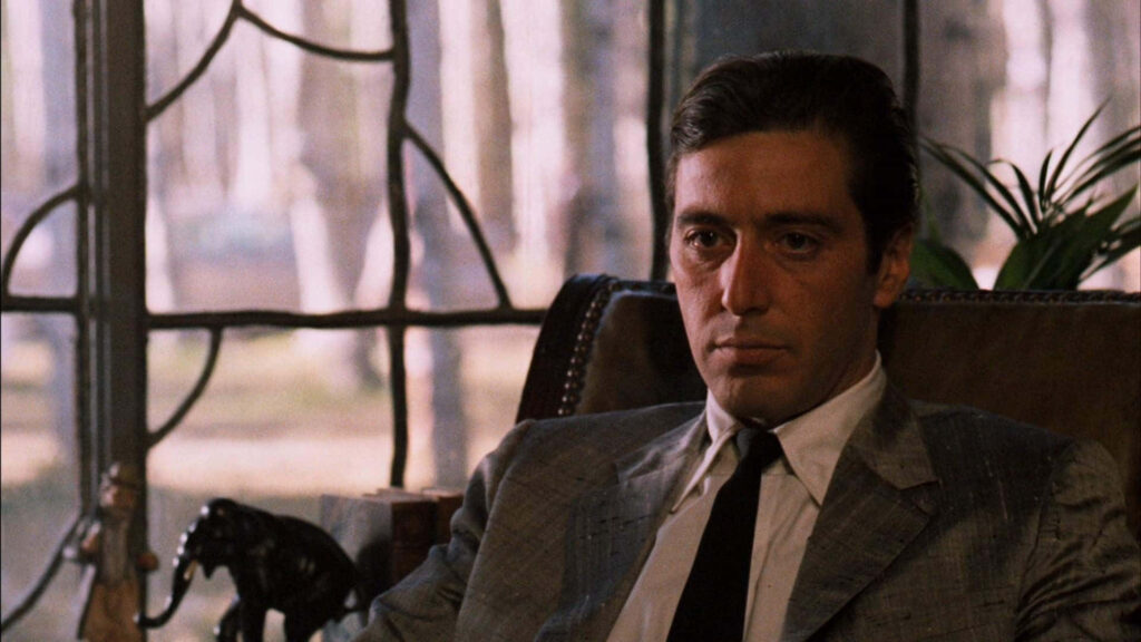 Michael Corleone Wallpaper: Intense Portrait in Dim Light