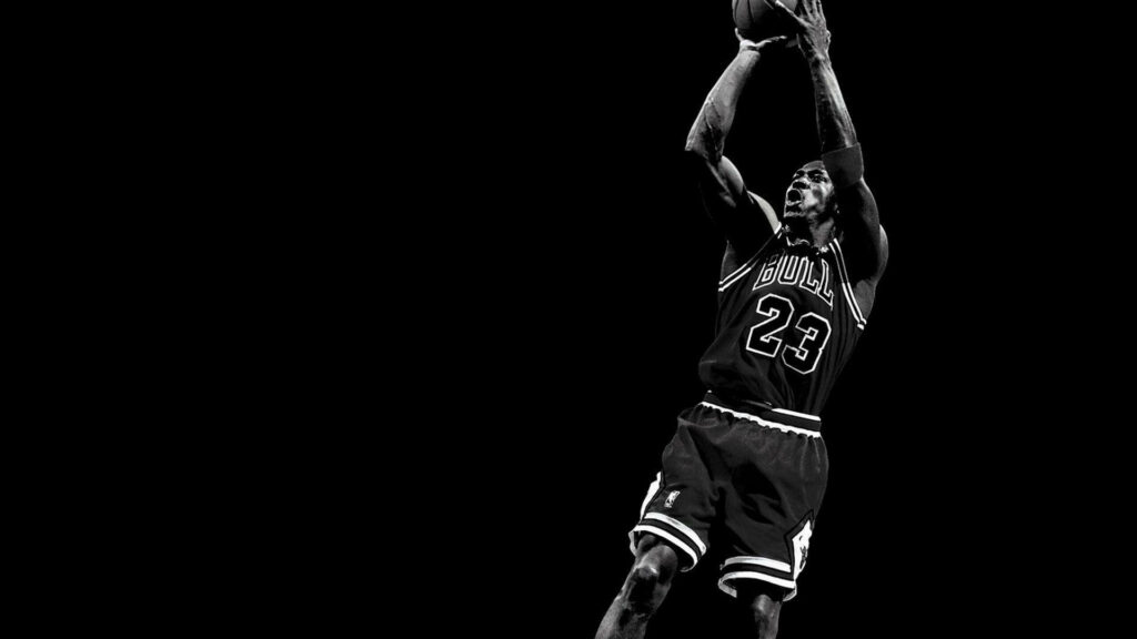 The Timeless Legacy of Michael Jordan: A Masterful Display of the Iconic Fade Away Move in the Basketball World Wallpaper