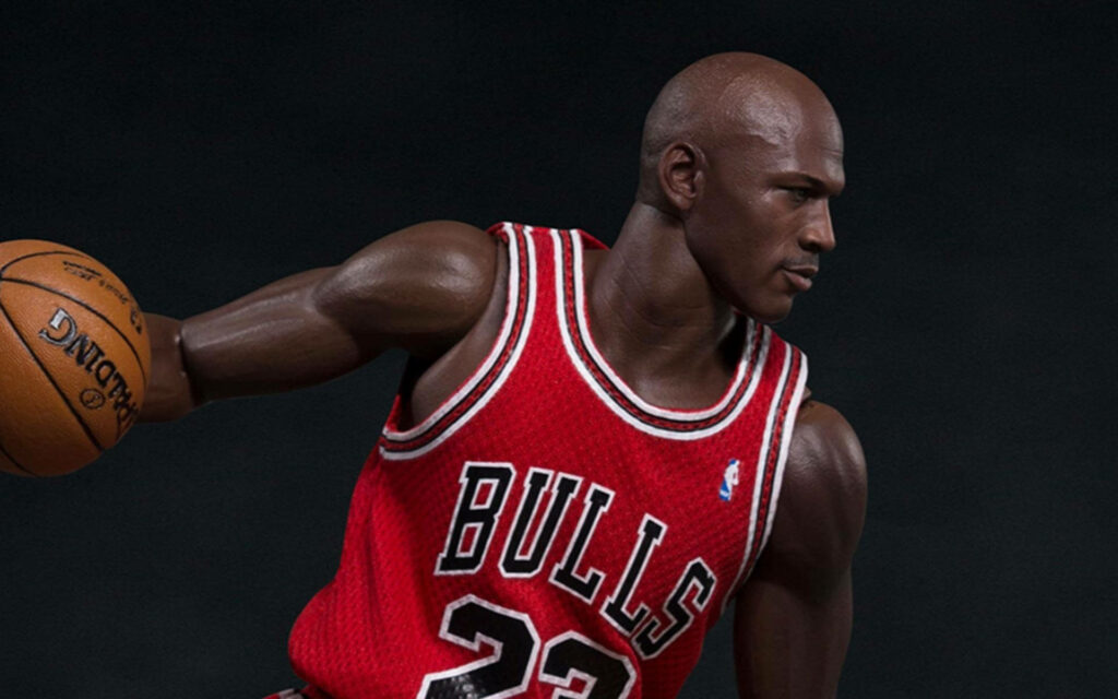 The Living Legend: Michael Jordan Embracing Greatness in Motion Wallpaper