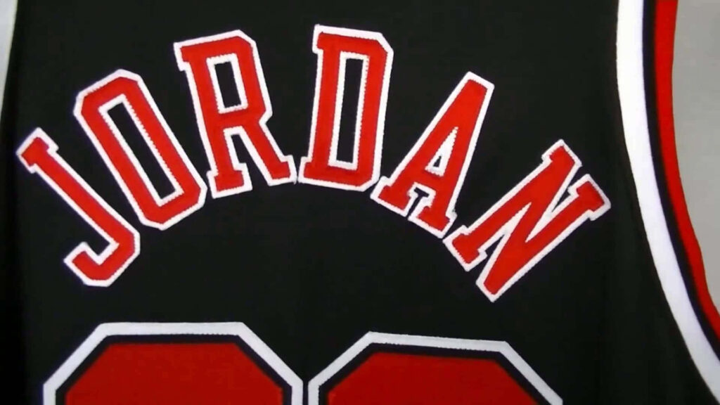 The Iconic Legacy: Michael Jordan's Jersey Graces this Striking Background Display Wallpaper