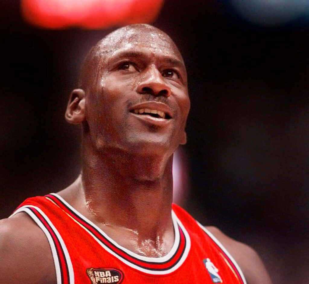 Defying Gravity: Michael Jordan's Iconic Mid-Air Soars Amidst Basketball Glory Wallpaper in 720p HD 1200x1100 Resolution