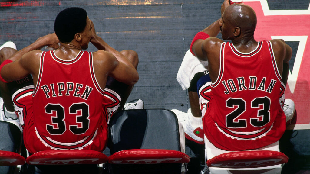 The Great One: Michael Jordan Dominates the Court with Unmatched Skill and Legacy Wallpaper