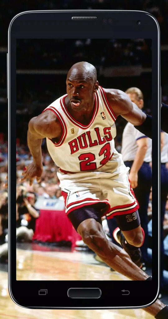 Airborne Legend: Michael Jordan's Unstoppable Magic on the Court Wallpaper