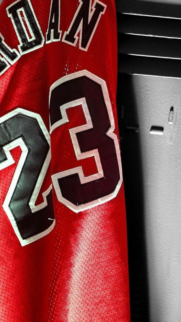 The Iconic Chicago Bulls Jersey: A Close-Up Snapshot Showcasing Michael Jordan's Impeccable Number 23 Stitching Wallpaper