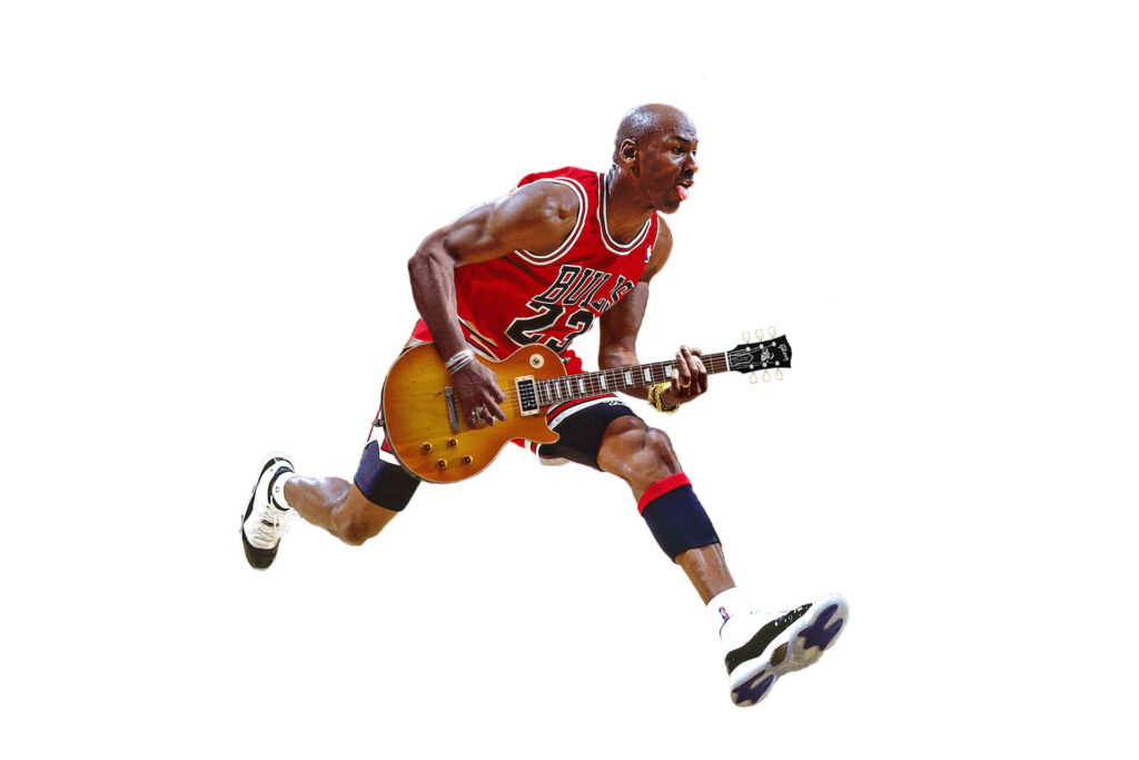 The Legend's Signature Style: Michael Jordan Dribbling with Air Jordan's in Close-up Action Wallpaper