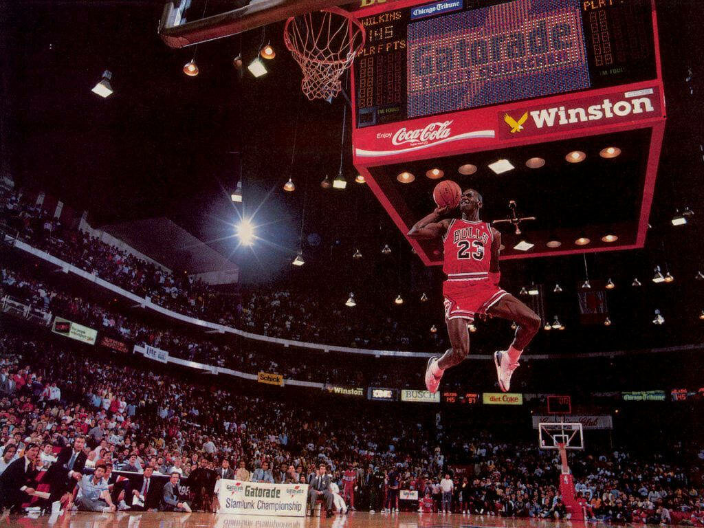 Airborne Majesty: Michael Jordan's Breathtaking NBA Hustle Wallpaper