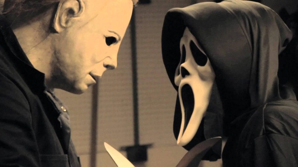 Michael Myers and Ghostface face off in a cinematic sepia-toned slasher horror wallpaper