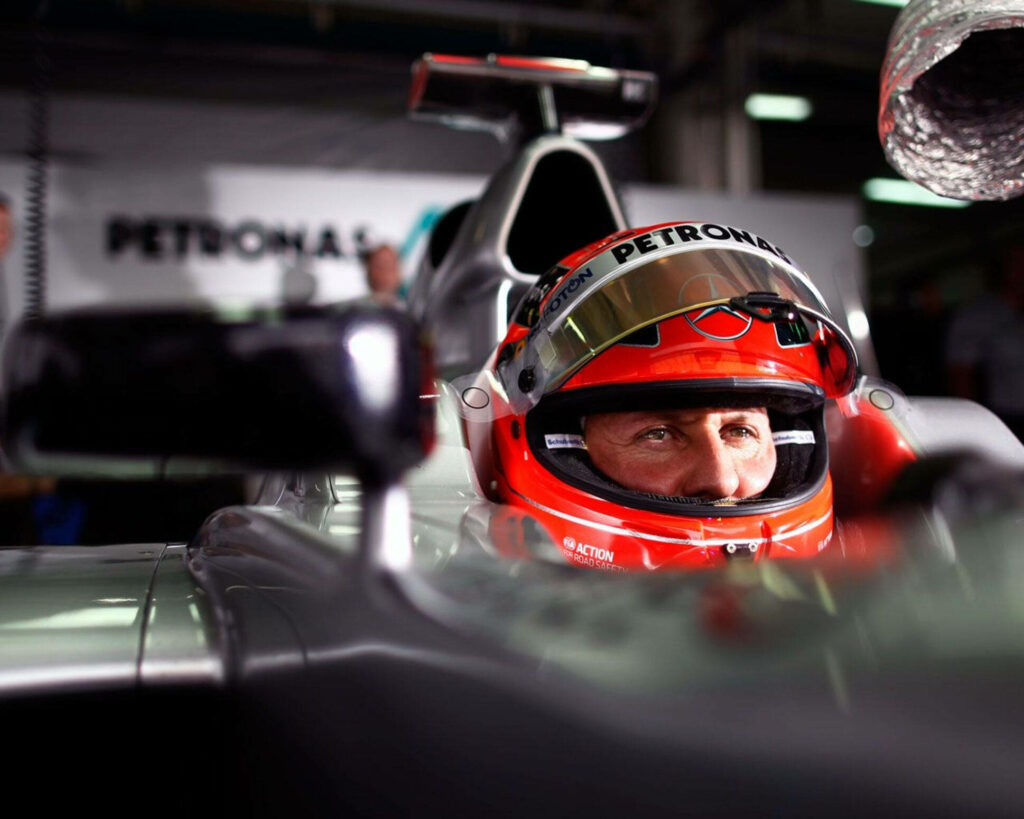 Michael Schumacher Focused: Captivating F1 Wallpaper Background