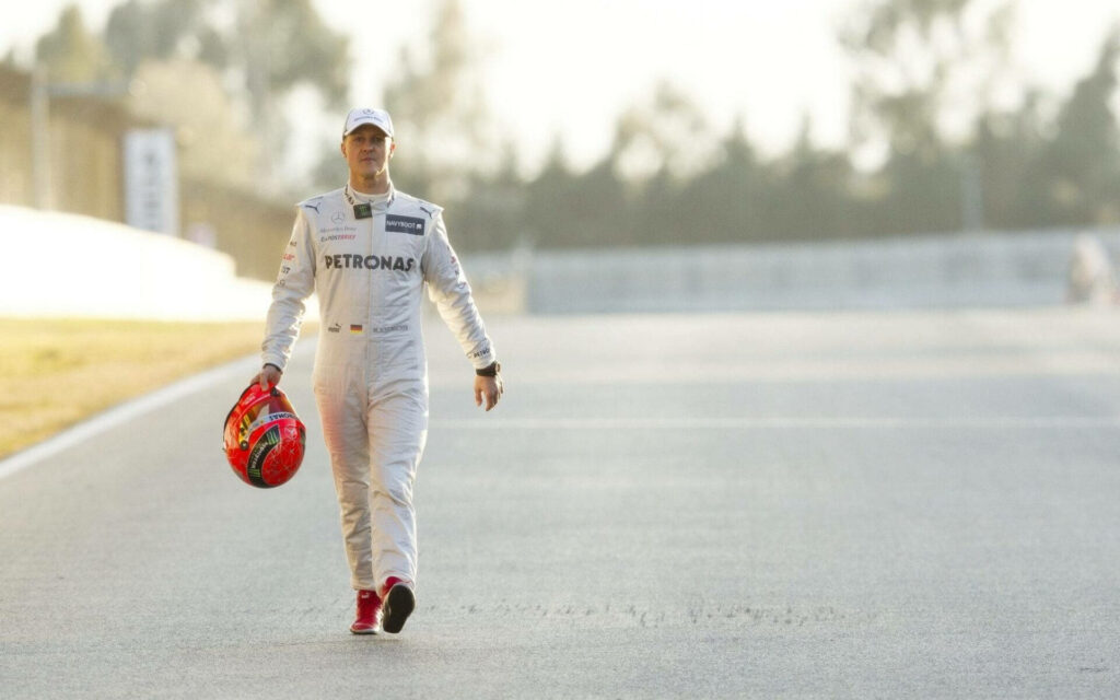 Michael Schumacher Serene Wallpaper: Racing Suit & Red Helmet Design