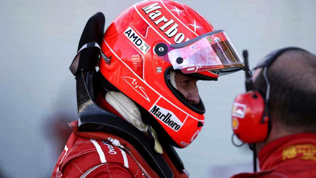 Michael Schumacher Red Racing Suit Wallpaper - Focused Motorsport Edge