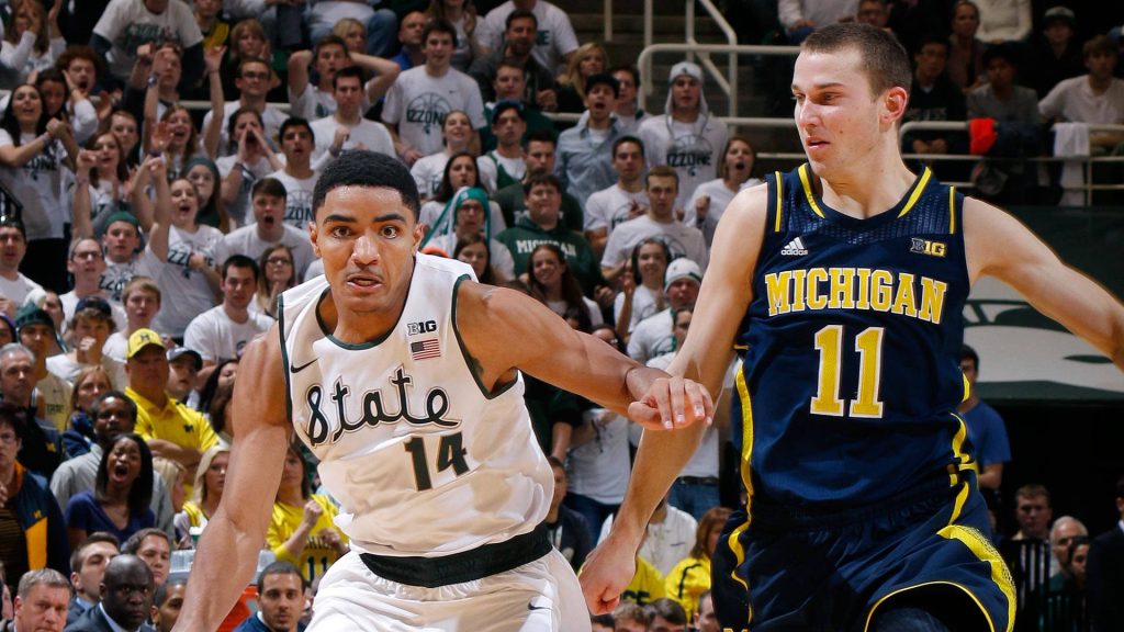 Gary Harris Michigan State #14 vs Nik Stauskas Michigan #11 intense college basketball rivalry action wallpaper