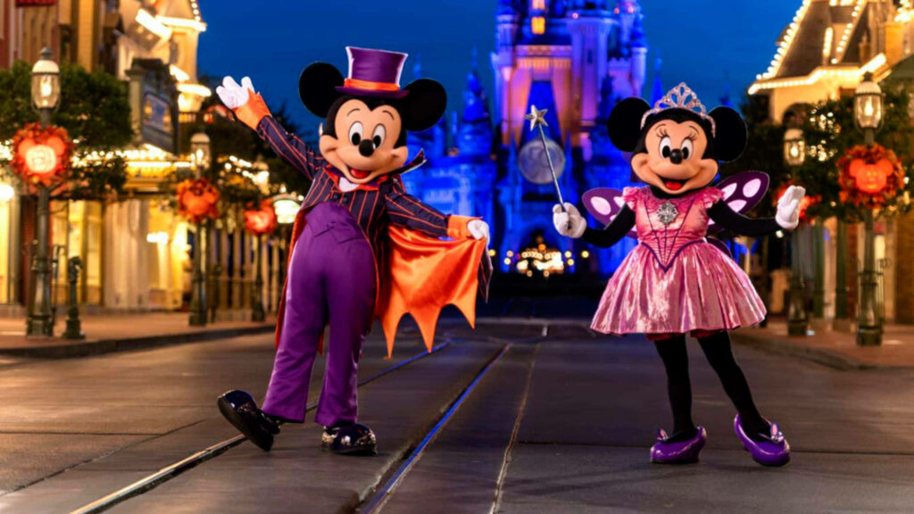 Mickey and Minnie's Magical Halloween Extravaganza: A Charming Disney Welcome! Wallpaper
