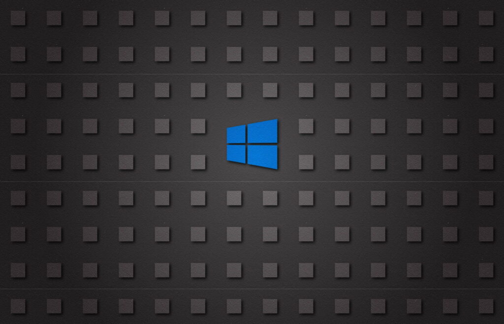 Microsoft Windows 8 wallpaper with vibrant blue logo on dark textured gray grid background