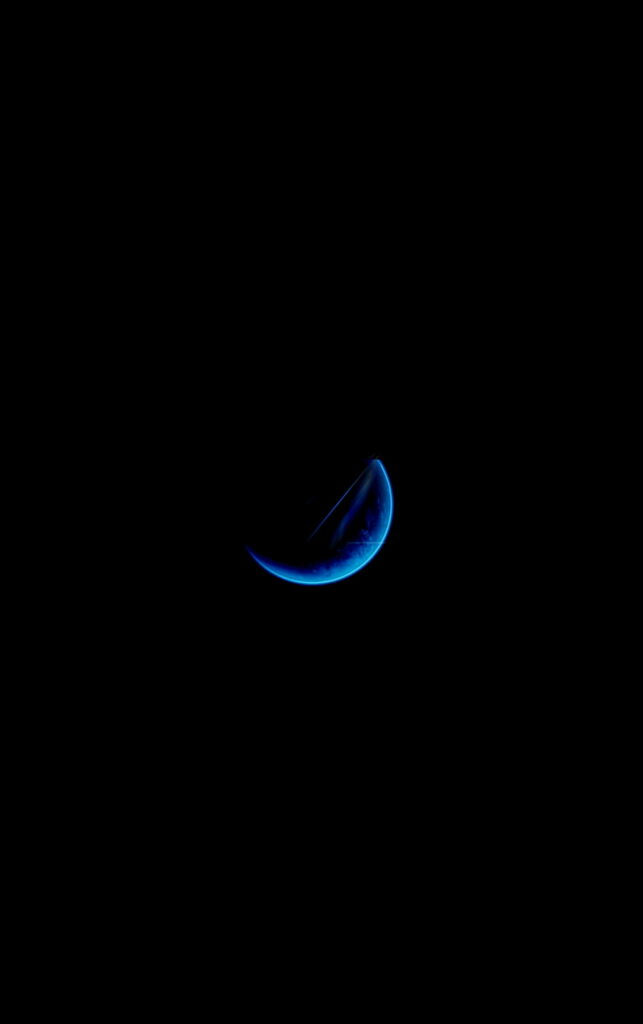 Nightfall Brilliance: Mesmerizing Black and Blue Half Moon in the Dark Sky - HD Phone Wallpaper Background Photograph