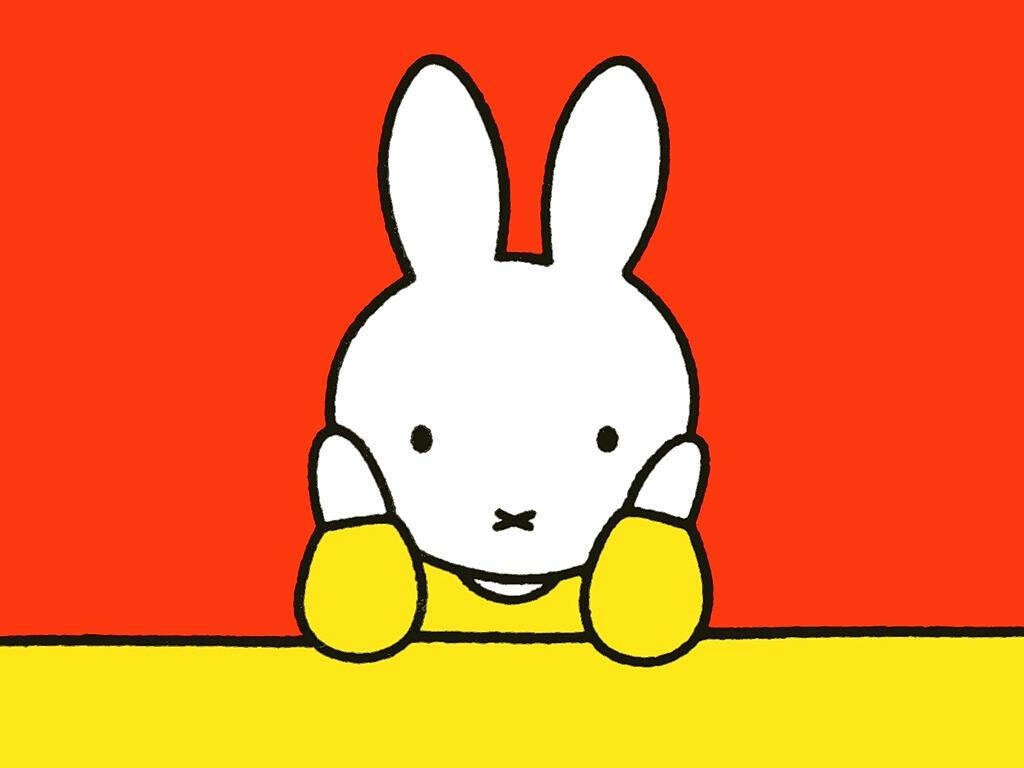 Miffy Bunny: A Bright and Playful Close-up Portrait on Vibrant Orange and Yellow Backdrop Wallpaper