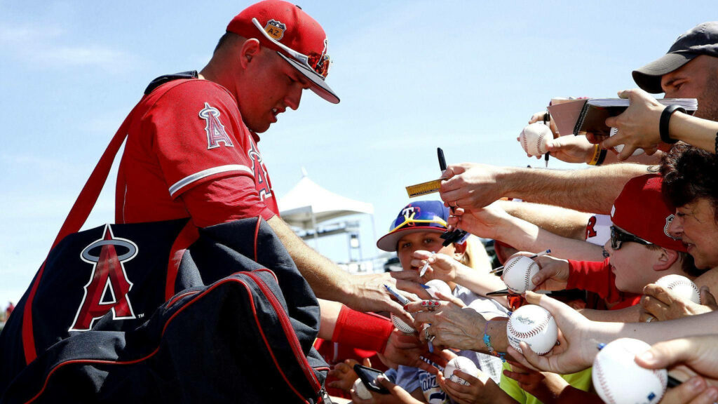 Mike Trout Signs Autographs for Fans in Team Uniform - Wallpaper