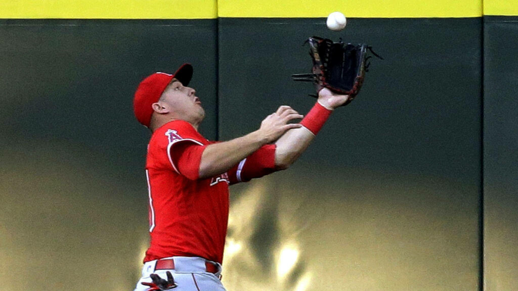 Mike Trout Mid-Action Wallpaper: Captivating Outfield Athleticism