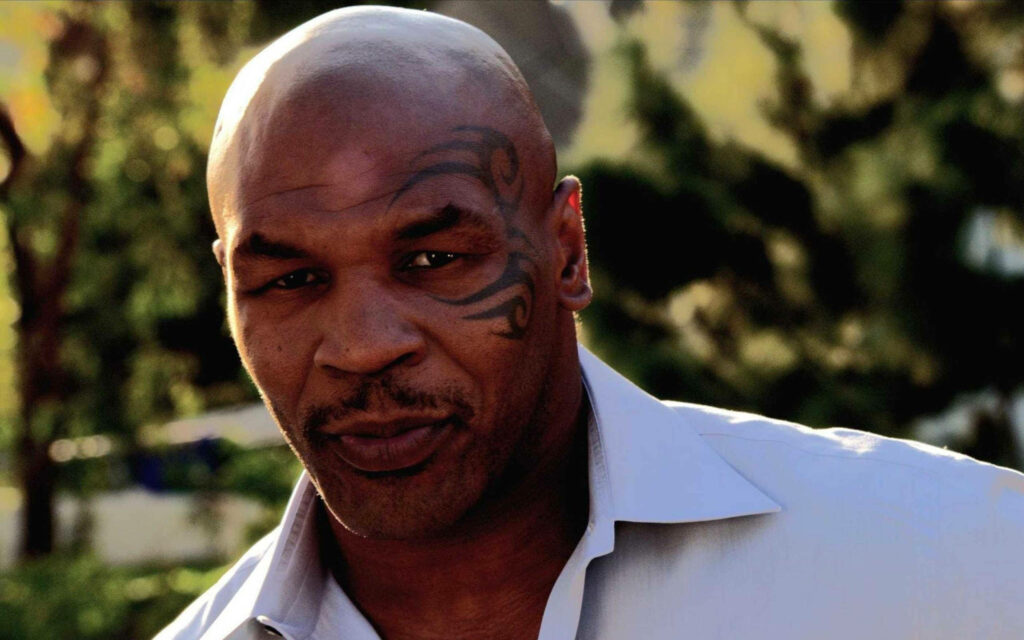 Polo-Clad Mike Tyson in 4K: Nature's Majestic Backdrop Wallpaper