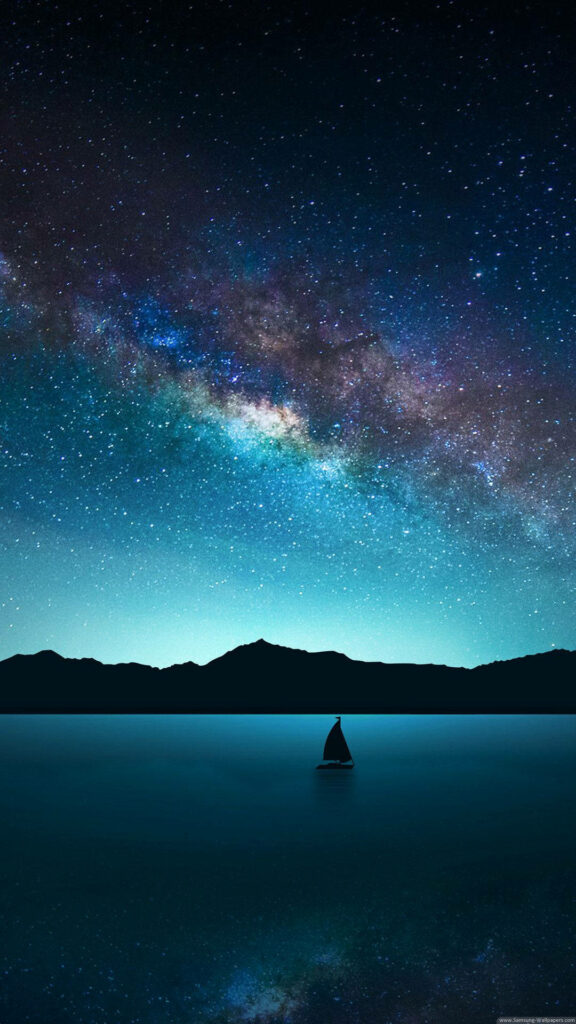 Majestic Milky Way over calm lake with sailboat silhouette and distant mountains night wallpaper