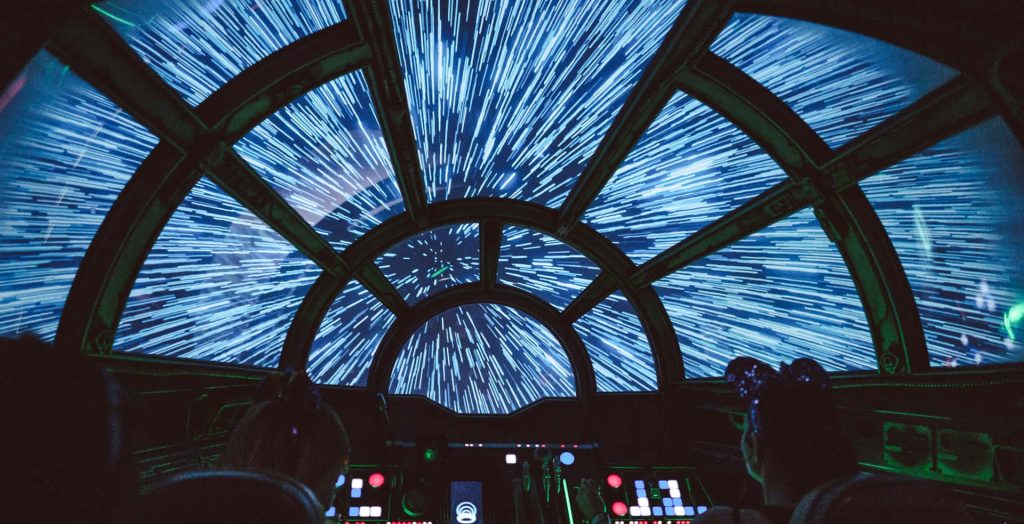 Millennium Falcon cockpit in blue hyperspace Star Wars wallpaper galaxy far far away background