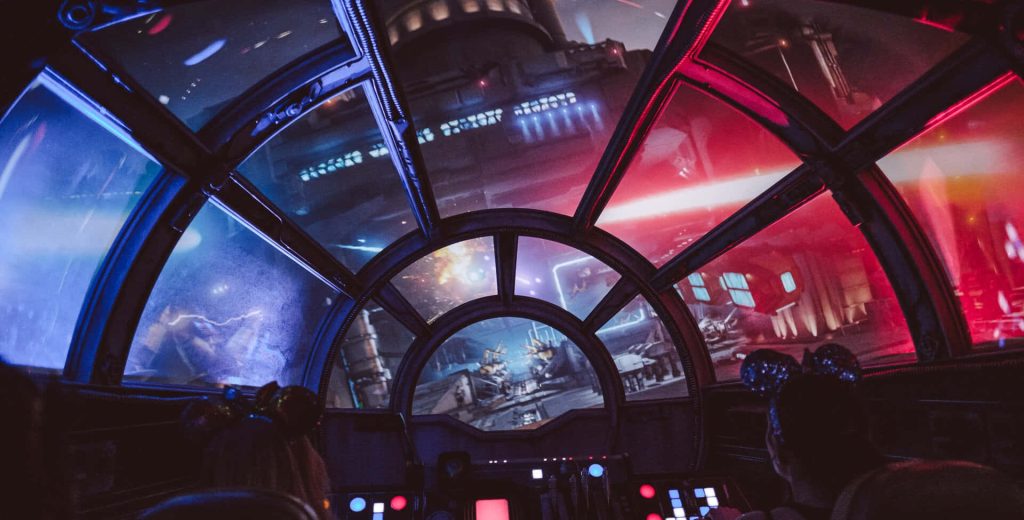 Millennium Falcon cockpit view Disney Smugglers Run Star Wars vibrant space battle wallpaper