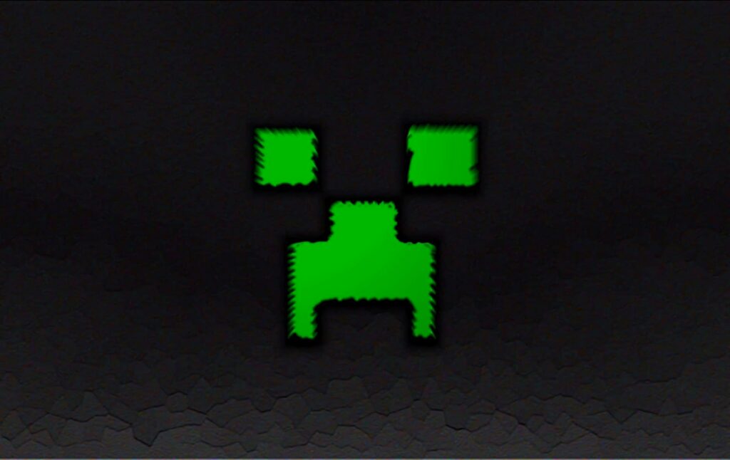 Minecraft Creeper face wallpaper with pixelated green and black design on dark background