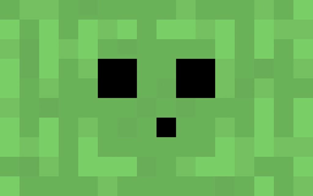 Minecraft Creeper face pixel art wallpaper with bold green shades and classic blocky design