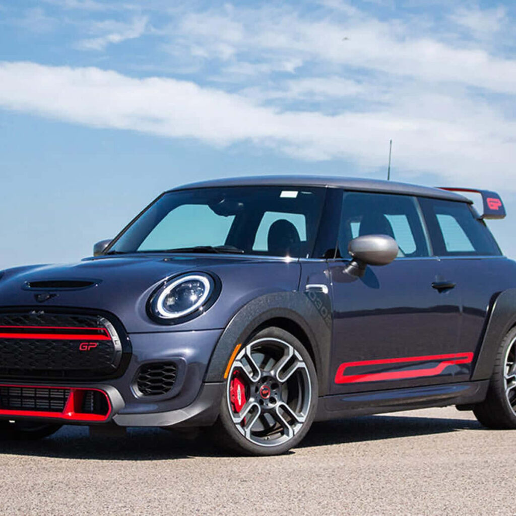 Sleek Mini Cooper Hardtop Wallpaper: Sporty Design & Vibrant Sky