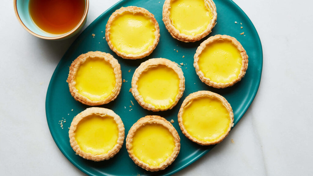 Gourmet Delight: Mini Custard with Yellow Tart atop a Grand Plate Wallpaper