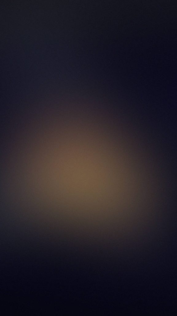Minimal abstract wallpaper with smooth gradient black edges to warm amber center glow