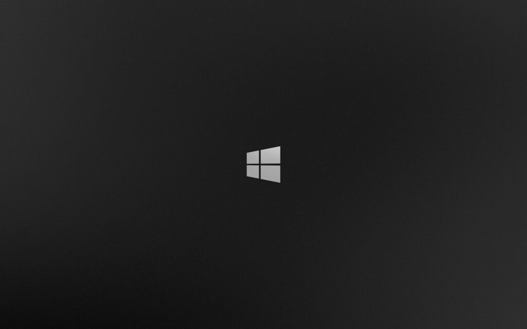 Minimalist Windows 8 wallpaper with skewed logo on dark gray textured grid background desktop