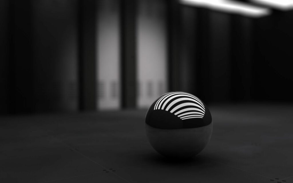 Sleek Black Ball with White Geometric Pattern - Minimalist Wallpaper