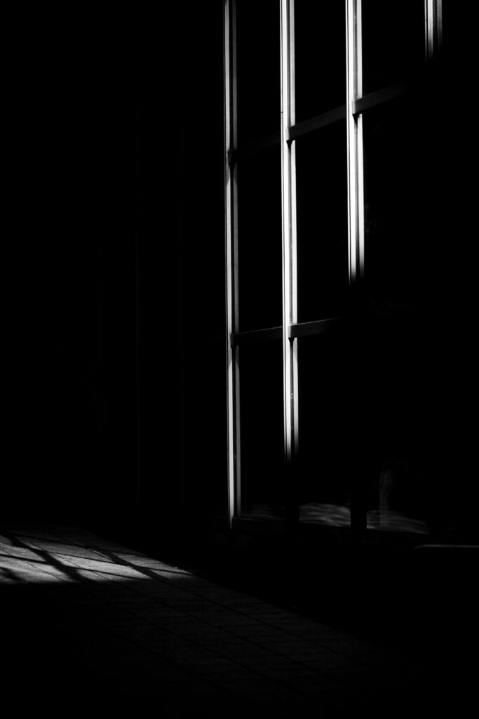 Minimalist 3840x5760 Wallpaper: Dark Room with Soft Dramatic Light