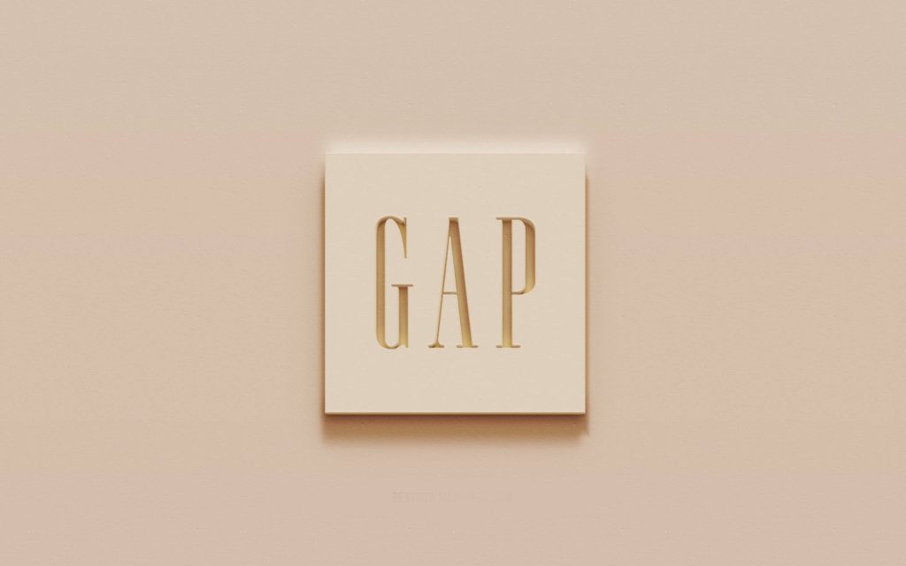 Sleek 3D Gap logo embossed on beige plaque minimalist modern wallpaper background desktop art