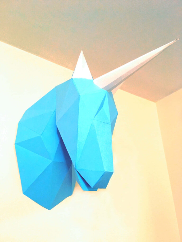 Minimalist 3D Geometric Unicorn Head Wallpaper on Plain Background