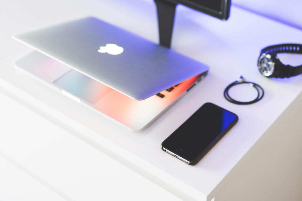 Modern Minimalist Wallpaper: Sleek Tech on White Desk
