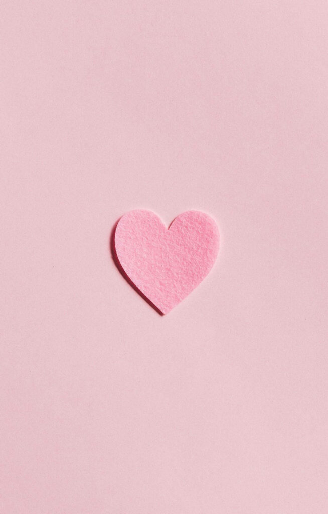 Elegant Baby Pink Heart on Soft Pink Minimalist Wallpaper Background