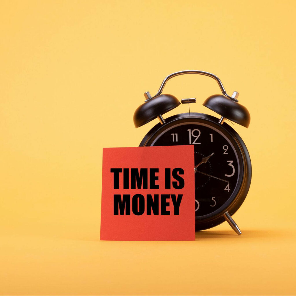 Classic black alarm clock with red Time Is Money card on yellow background motivational concept Wallpaper