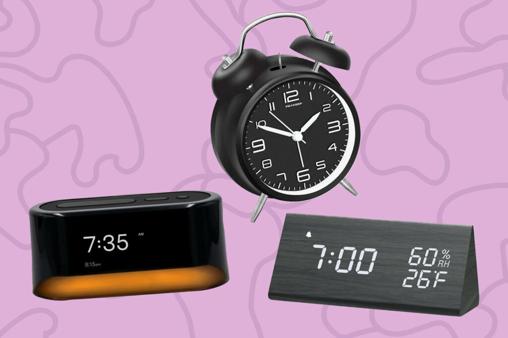 Stylish modern and classic black alarm clocks on pastel purple abstract background wallpaper