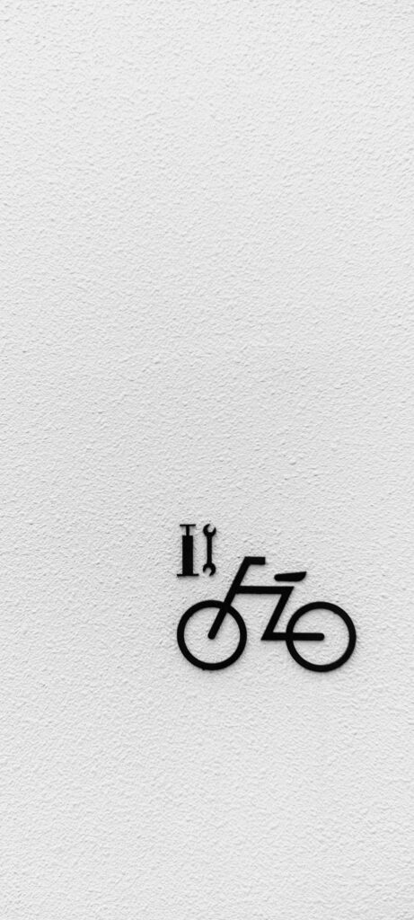 Minimalistic black bicycle graphic on textured white background OnePlus 9R wallpaper design