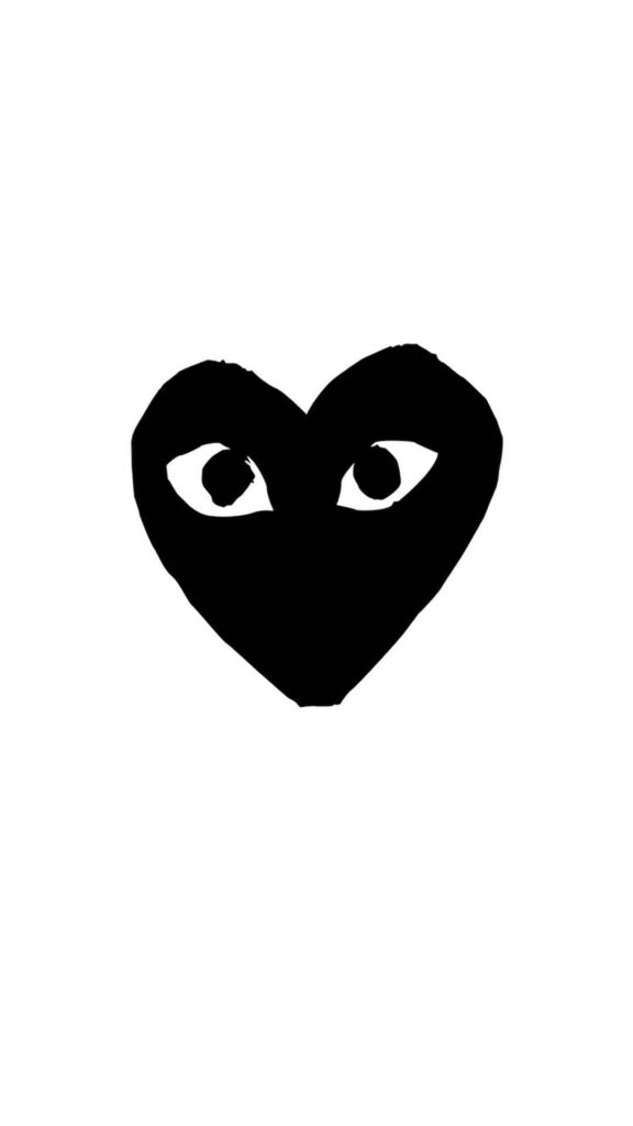 Bold Minimalist Wallpaper: Black Heart with Eyes on White Background