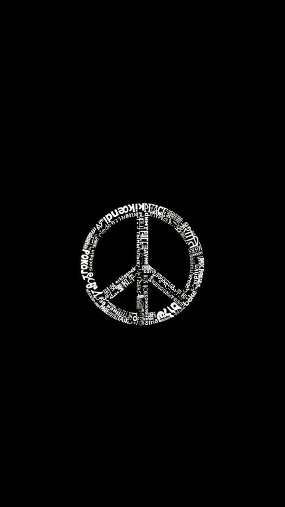 Minimalist black wallpaper with a white peace symbol formed by the word peace in multiple languages