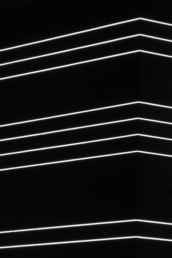 Modern Minimalist Wallpaper: Neon White Stripes on Black Background