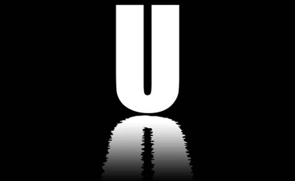Minimalist white letter U with rippling water reflection on black modern wallpaper background