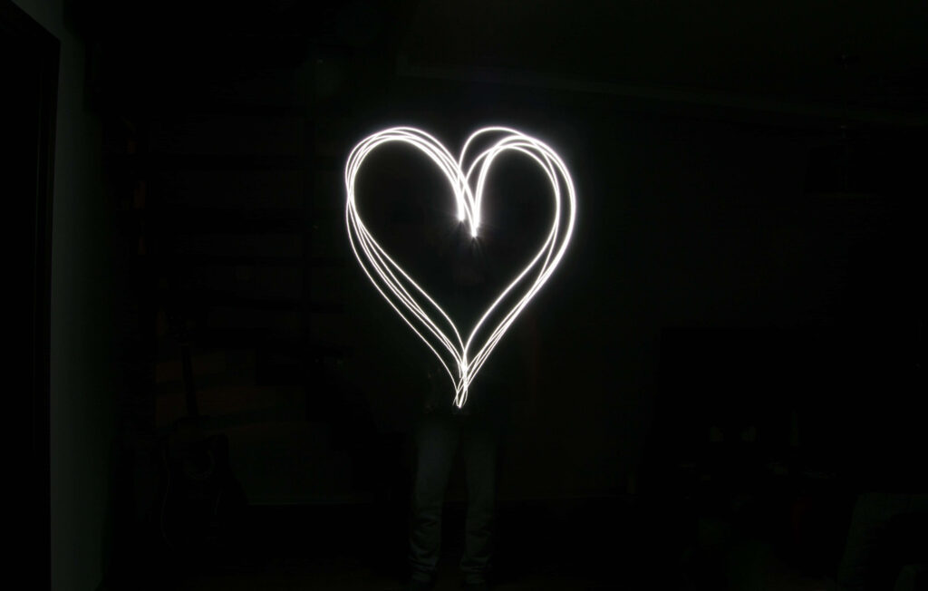 Minimalist Black and White Wallpaper with Glowing Heart Design