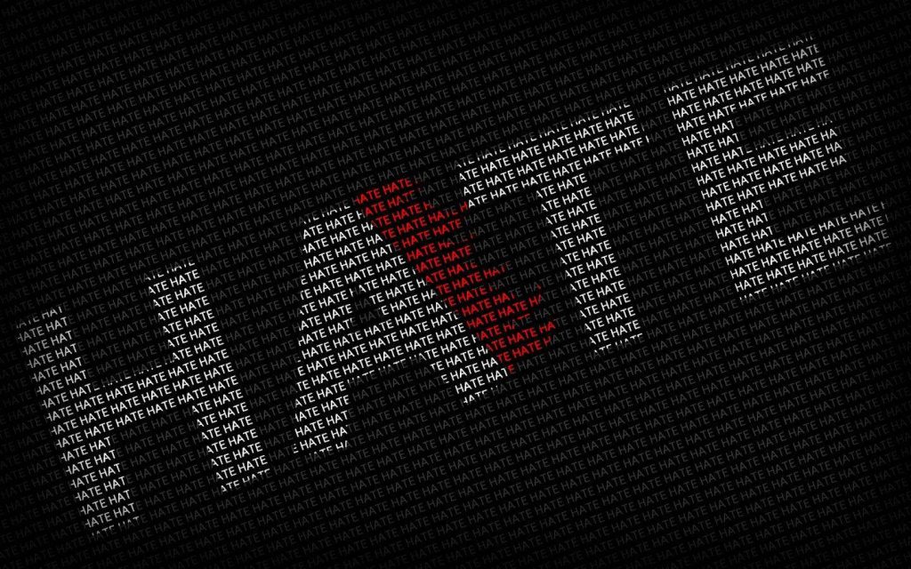 Minimalist wallpaper with bold white HATE text pattern on black background for edgy screens