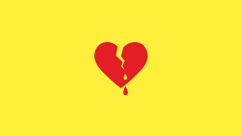 Minimalist broken heart bleeding on bold yellow background symbolizing love failure pain wallpaper