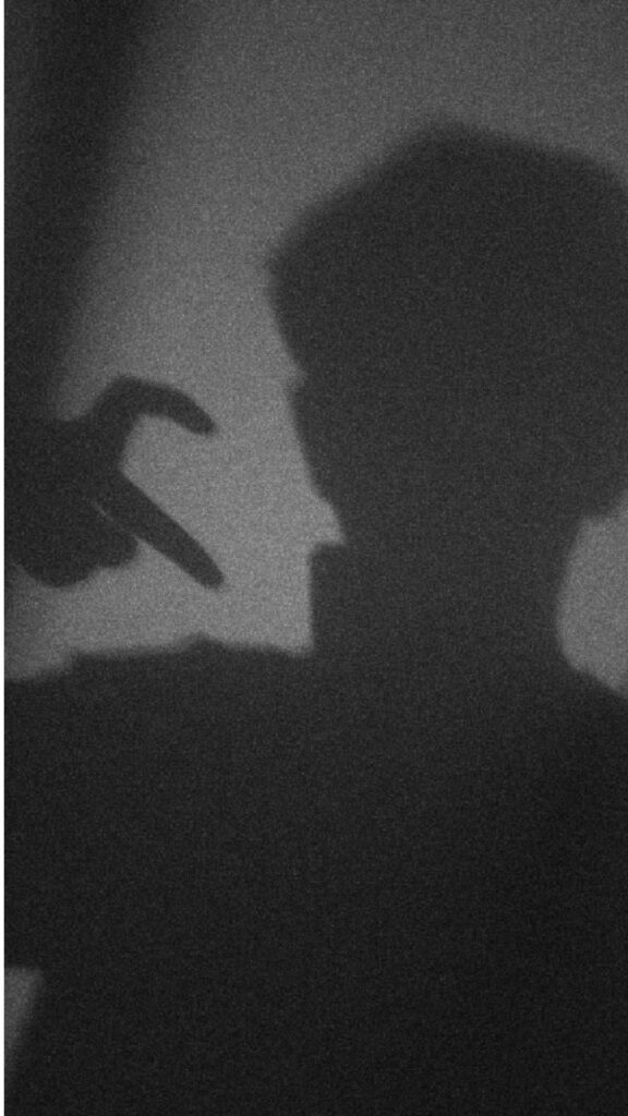 Boy's Hand Shadow Creates Minimalist Heart Against Plain Background Wallpaper