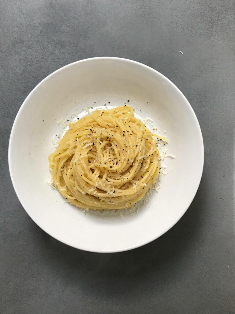 Minimalist Cacio e Pepe Wallpaper: Elegant Spaghetti with Cheese Sauce